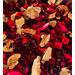 A close up view of the Apple Cinnamon Potpourri by Irish Twins Potpourri showing the types of dried botanicals. The color is mostly red.